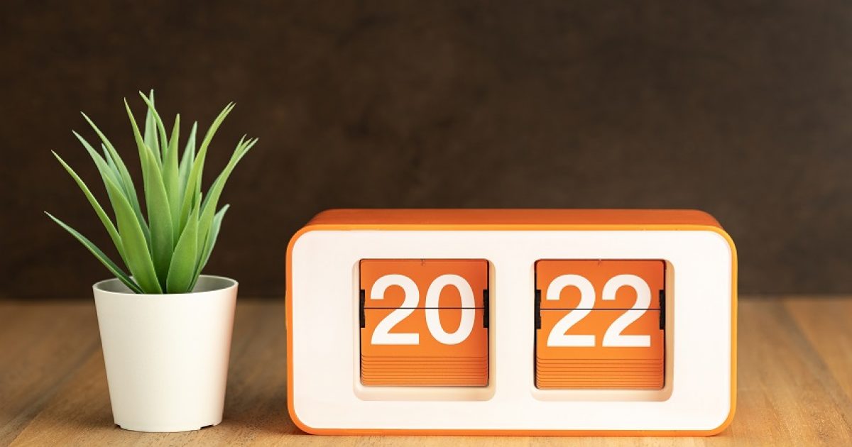 Retro Flip clock with 2022 number on wooden table - Decorating Trends in New Zealand for 2021